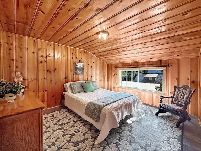 bedroom featuring wooden walls, wooden ceiling, and vaulted ceiling
