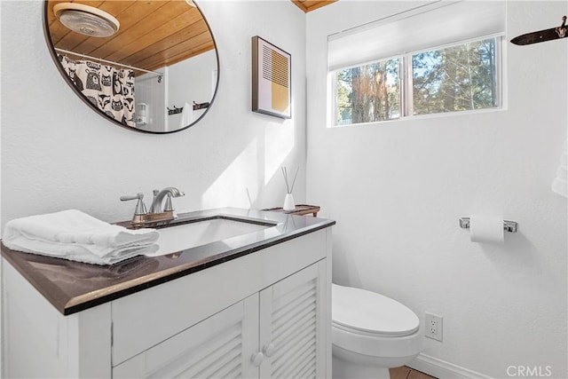 bathroom featuring wood ceiling, vanity, and toilet