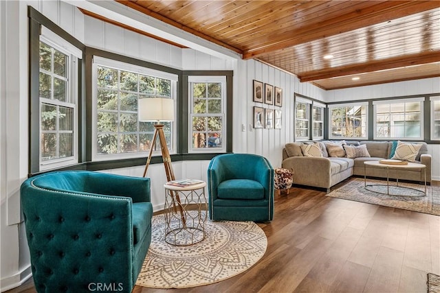 sunroom with beamed ceiling and wooden ceiling