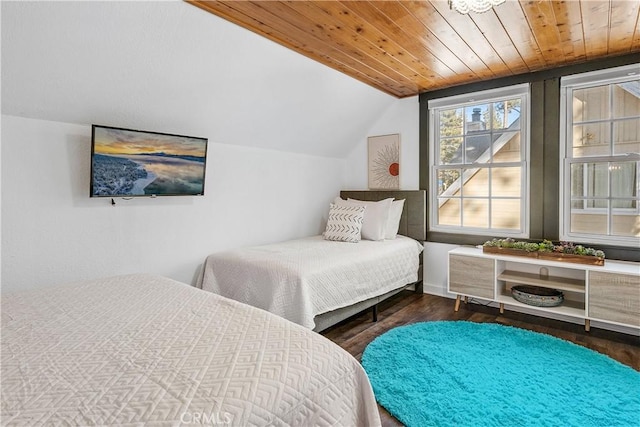 bedroom with hardwood / wood-style flooring, vaulted ceiling, and wooden ceiling