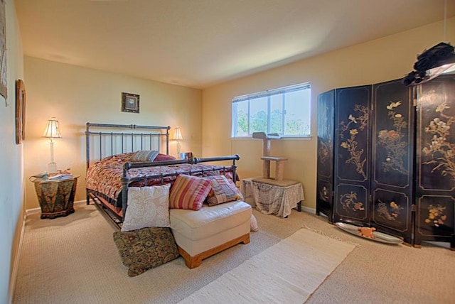 bedroom with light carpet