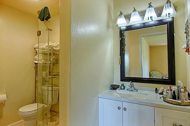 bathroom with toilet and oversized vanity