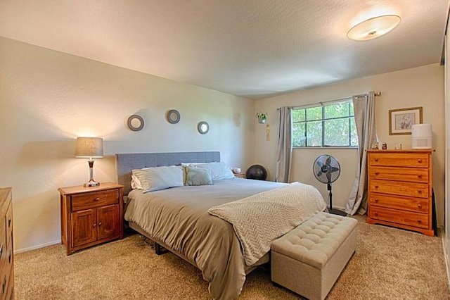 bedroom featuring light carpet