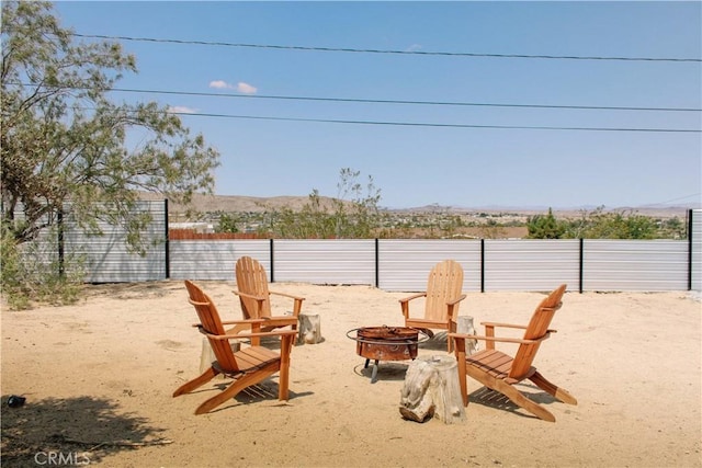 view of yard with a fire pit