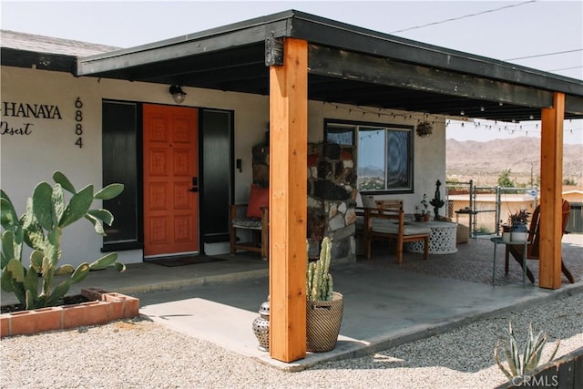 view of patio / terrace with a mountain view