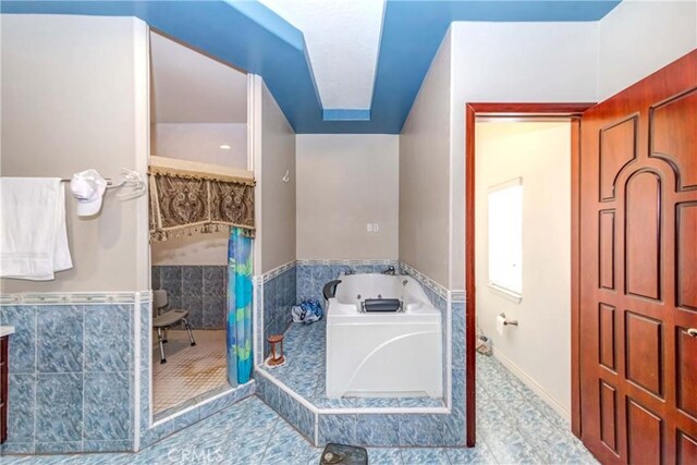 bathroom featuring a bathing tub and tile flooring