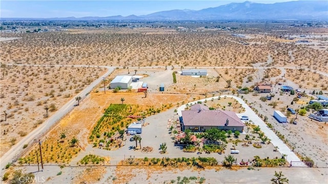 birds eye view of property with a mountain view