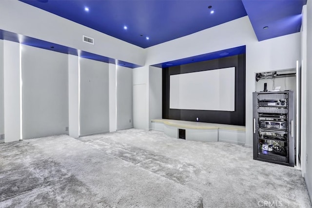 home theater with light colored carpet