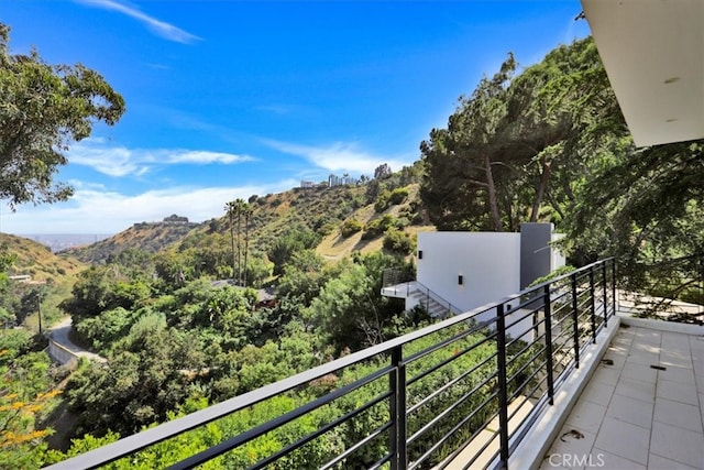 balcony featuring a mountain view