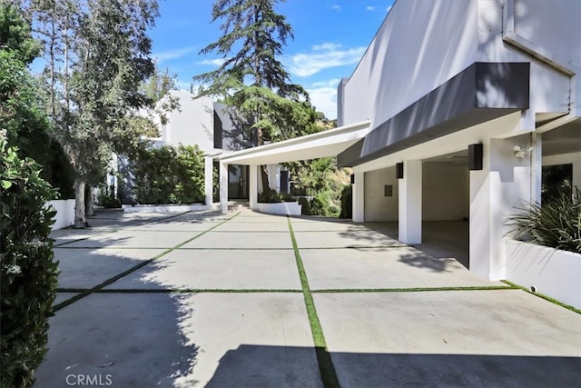 view of side of property with a patio