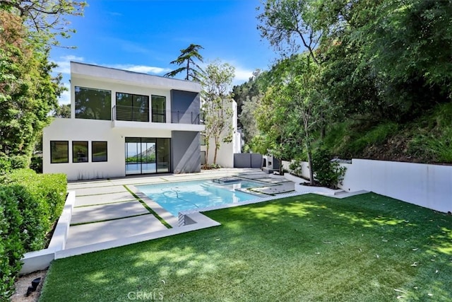 view of pool featuring a yard and a patio area