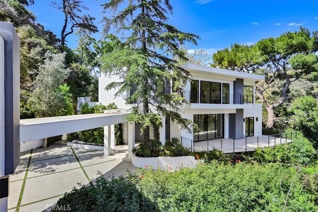 back of property with a balcony