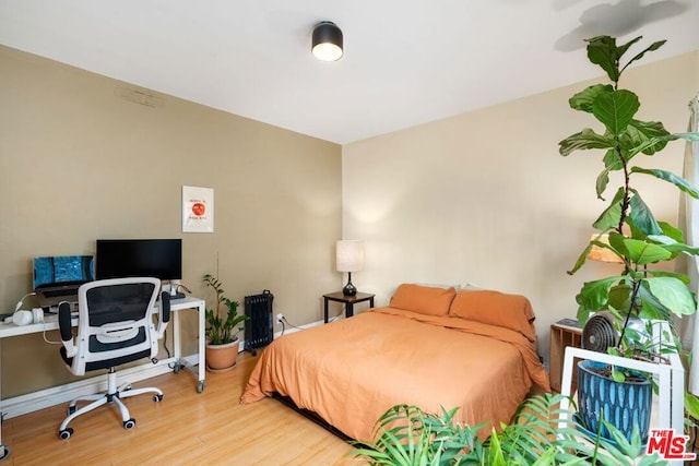 bedroom featuring hardwood / wood-style floors