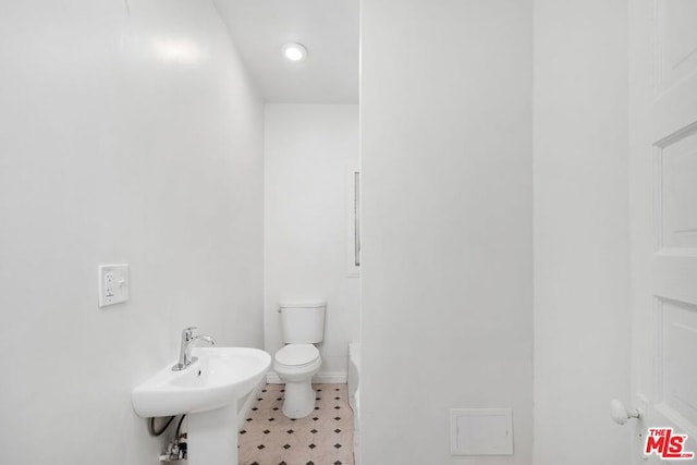 bathroom with toilet and sink