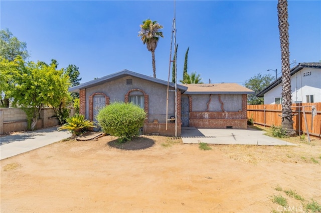 view of front of house with a patio area