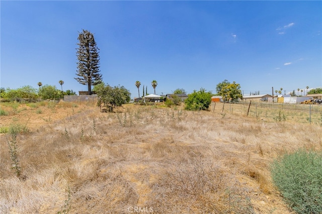 view of yard with a rural view