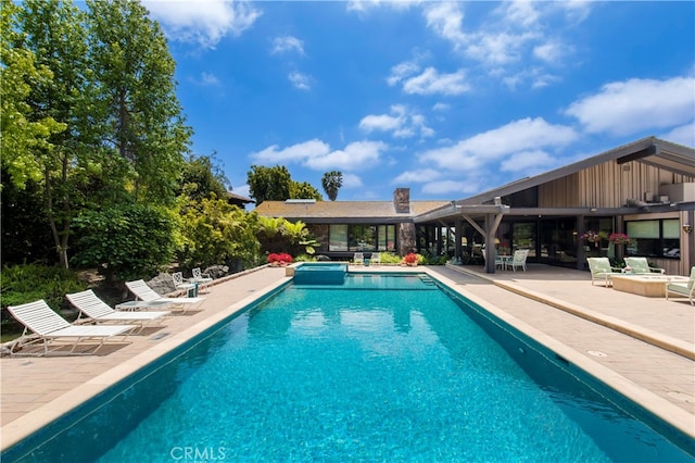 view of pool with a patio area