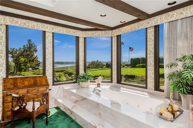 sunroom featuring beam ceiling and a water view