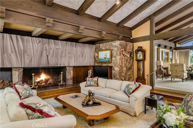 living room with lofted ceiling with beams and a fireplace