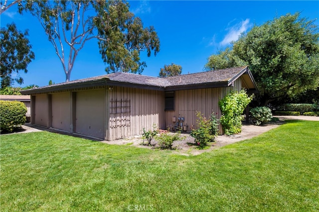 view of property exterior featuring a lawn