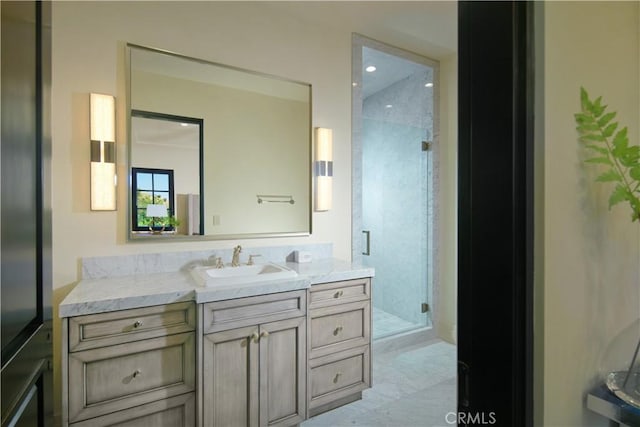 bathroom with an enclosed shower and vanity