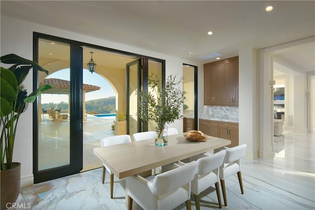 dining space with a water view