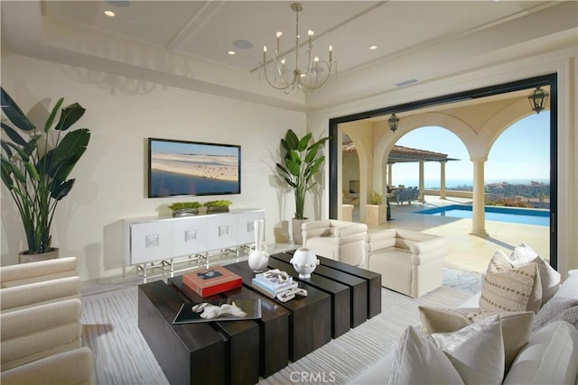 living room featuring a notable chandelier