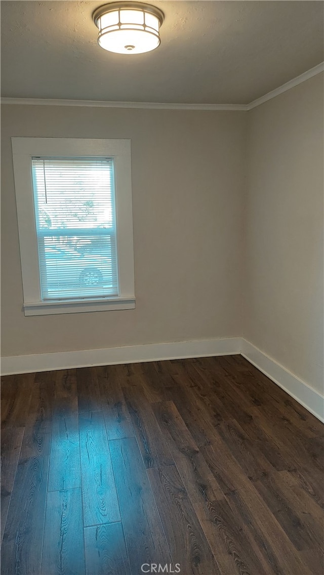 unfurnished room with hardwood / wood-style flooring and ornamental molding