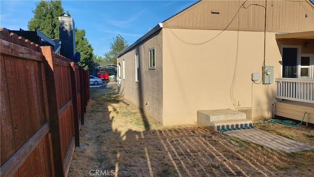 view of home's exterior featuring fence