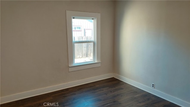 empty room with dark hardwood / wood-style floors