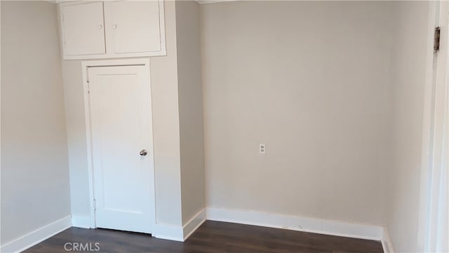 spare room with wood-type flooring