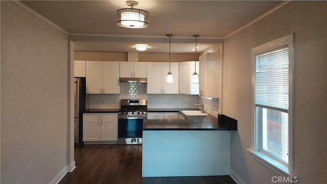 kitchen with appliances with stainless steel finishes, white cabinetry, and sink