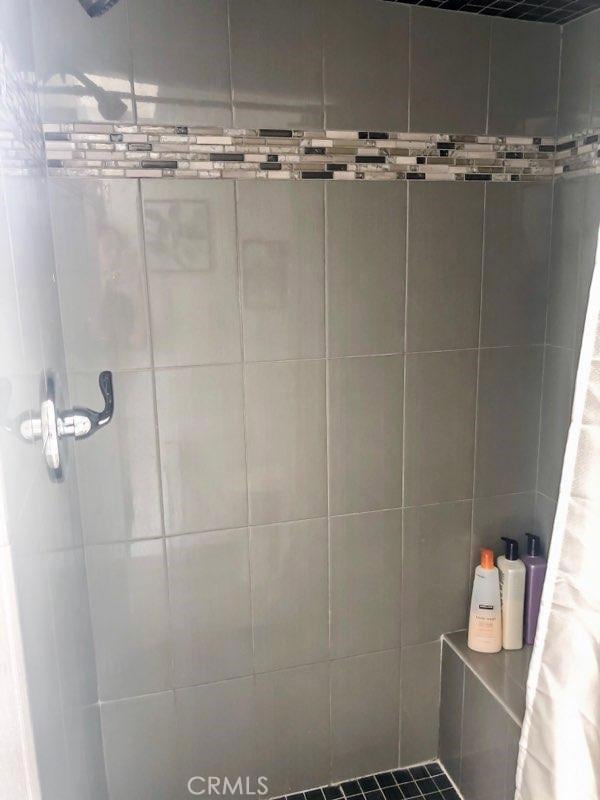 bathroom with a shower with curtain