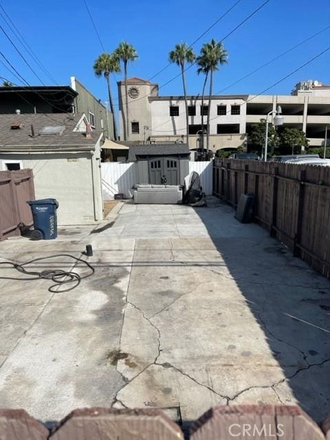 view of patio / terrace featuring a shed