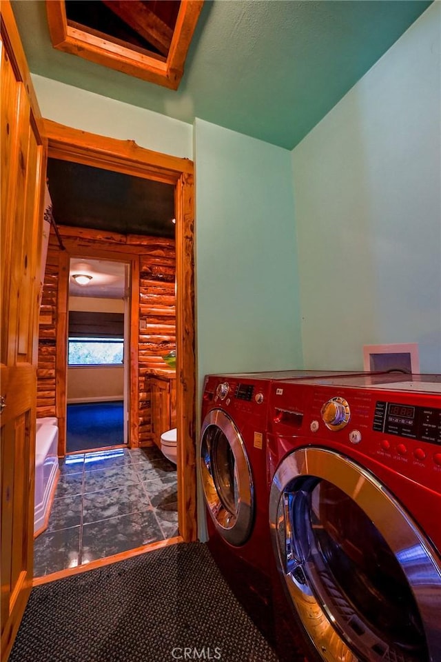 laundry room featuring separate washer and dryer