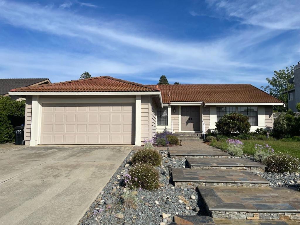 ranch-style house featuring a garage