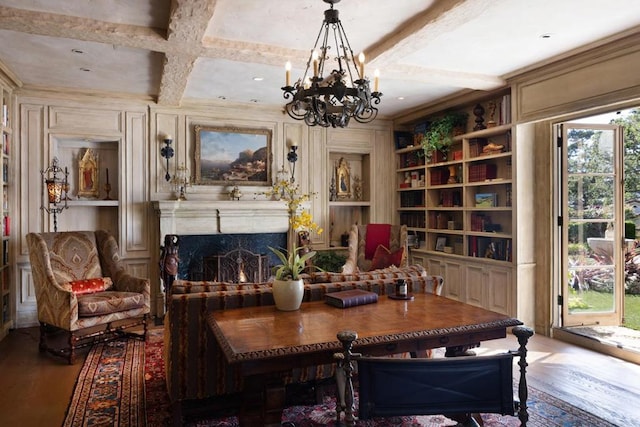 sitting room with hardwood / wood-style floors, a healthy amount of sunlight, and coffered ceiling