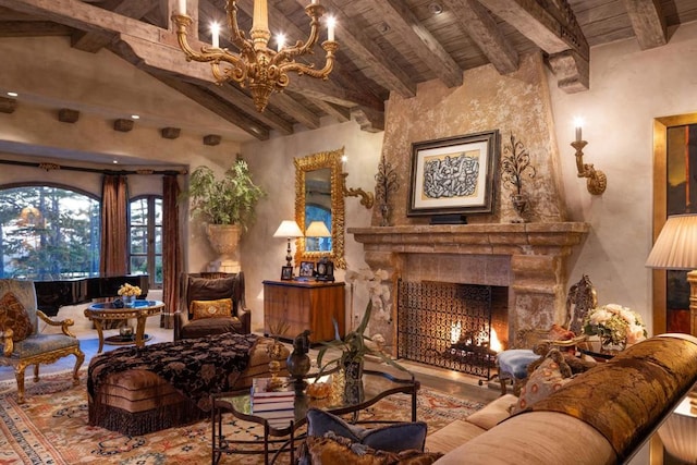 sitting room featuring lofted ceiling with beams, an inviting chandelier, and wooden ceiling