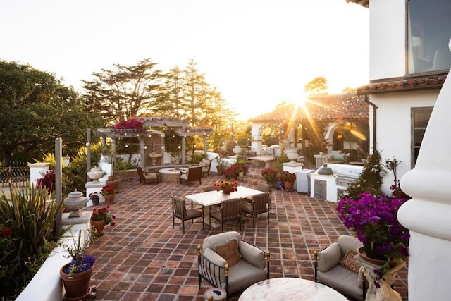 view of patio featuring an outdoor living space with a fire pit