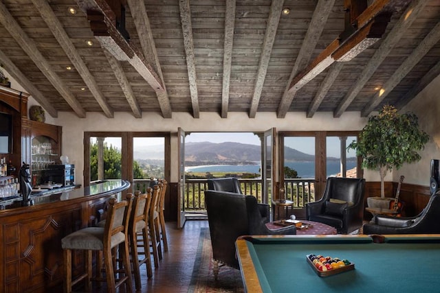 interior space with a water and mountain view, french doors, wooden ceiling, vaulted ceiling with beams, and pool table