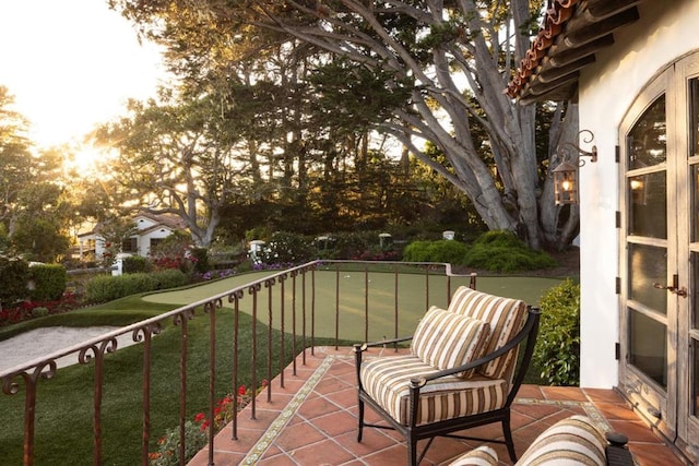 view of balcony at dusk