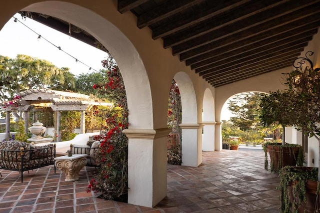 view of patio / terrace with a pergola and outdoor lounge area