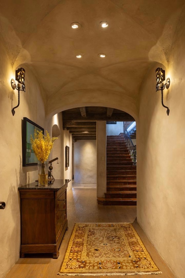 hallway featuring vaulted ceiling