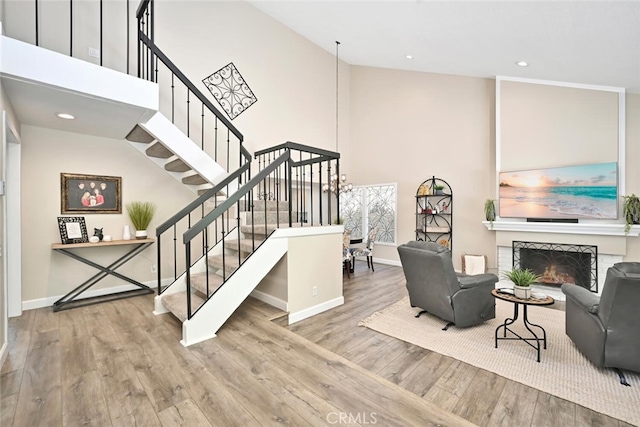 staircase featuring hardwood / wood-style floors and vaulted ceiling