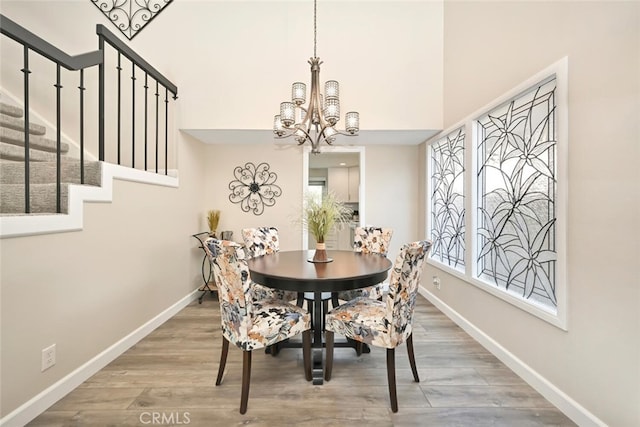 dining room with a chandelier and hardwood / wood-style floors