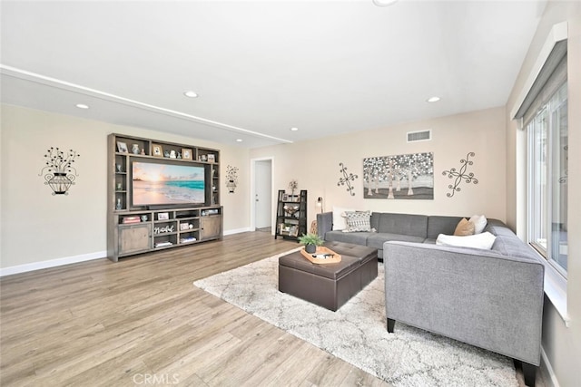 living room with light hardwood / wood-style floors