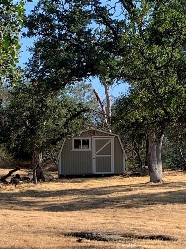 view of outdoor structure with a lawn