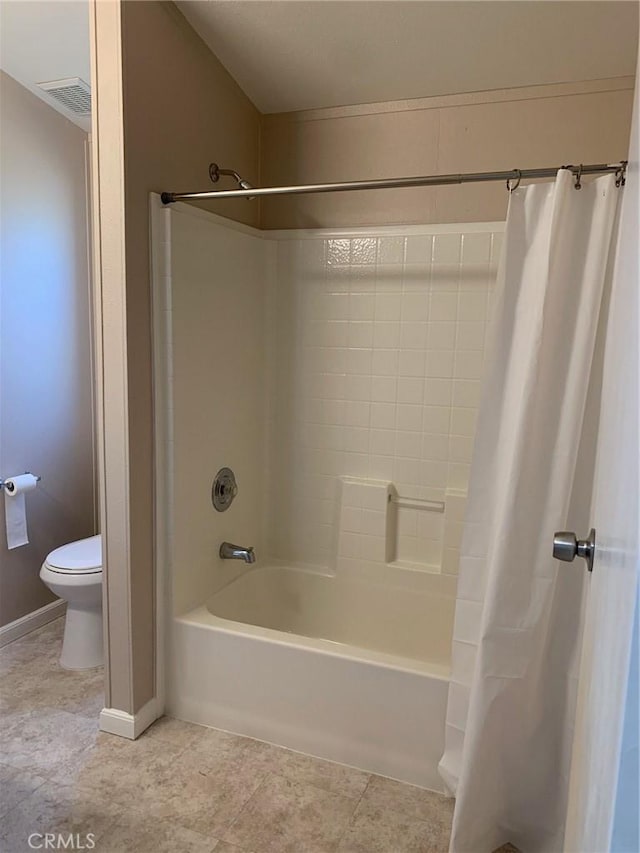 bathroom with toilet and shower / bathtub combination with curtain