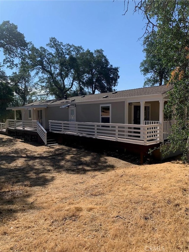 back of house with a yard