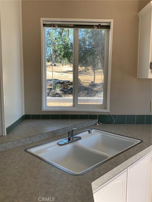 kitchen with white cabinets and sink